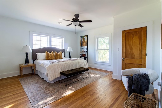 bedroom featuring ceiling fan and light hardwood / wood-style flooring