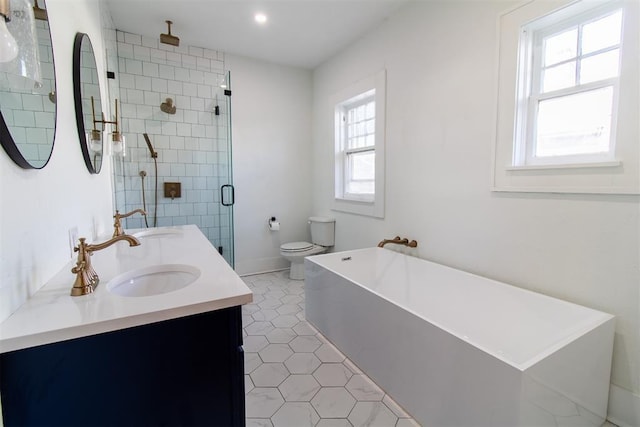 full bathroom featuring plus walk in shower, vanity, tile patterned flooring, and toilet