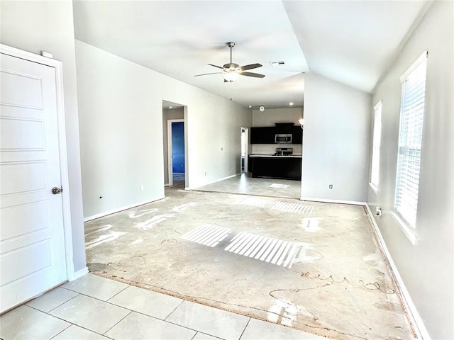 unfurnished living room featuring ceiling fan and lofted ceiling