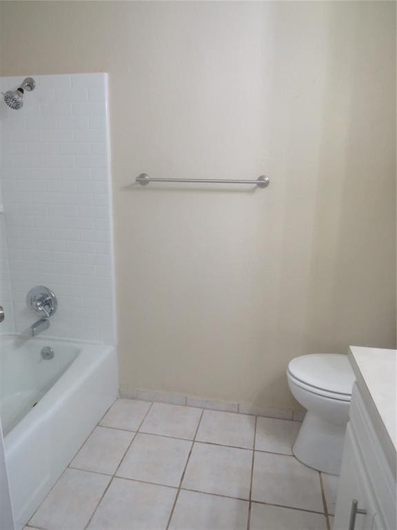 full bathroom with tile patterned flooring, vanity, toilet, and tiled shower / bath