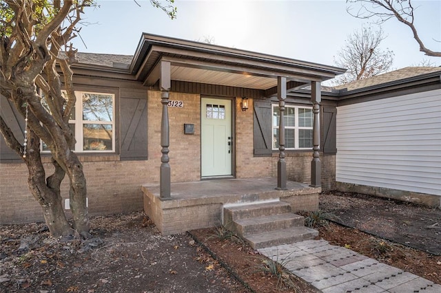 doorway to property with covered porch