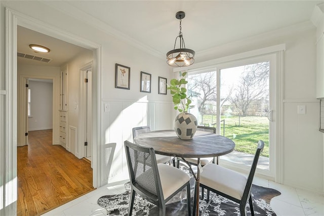 dining area featuring ornamental molding