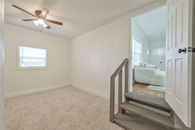 interior space with ceiling fan and carpet floors