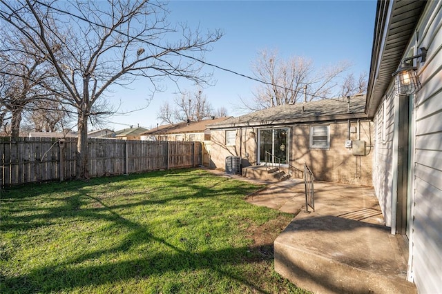 view of yard featuring a patio area and central air condition unit