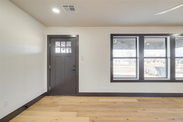 entrance foyer featuring light hardwood / wood-style flooring and a healthy amount of sunlight