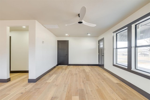 unfurnished room featuring light hardwood / wood-style floors and ceiling fan