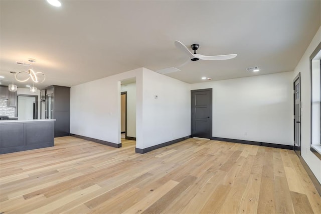 unfurnished room with ceiling fan and light hardwood / wood-style floors