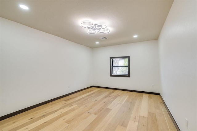 unfurnished room featuring wood-type flooring