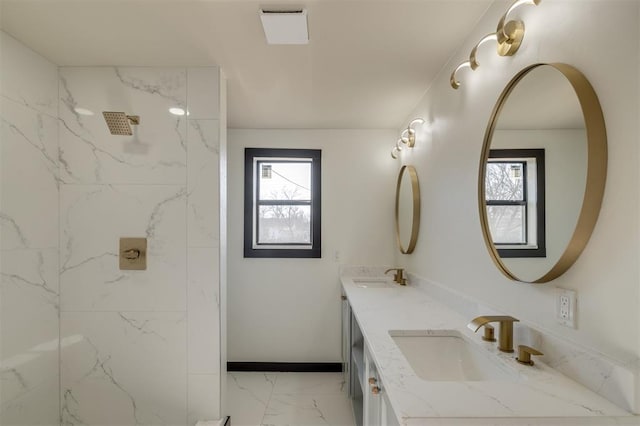 bathroom with a shower and vanity