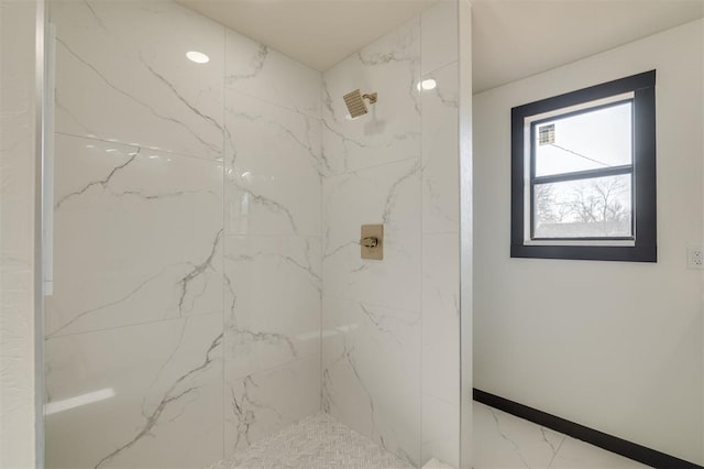 bathroom featuring a tile shower