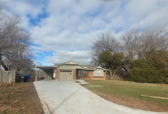 view of front of home featuring a front lawn, a garage, and a carport