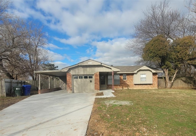 view of front of house with a front lawn, a garage, and a carport