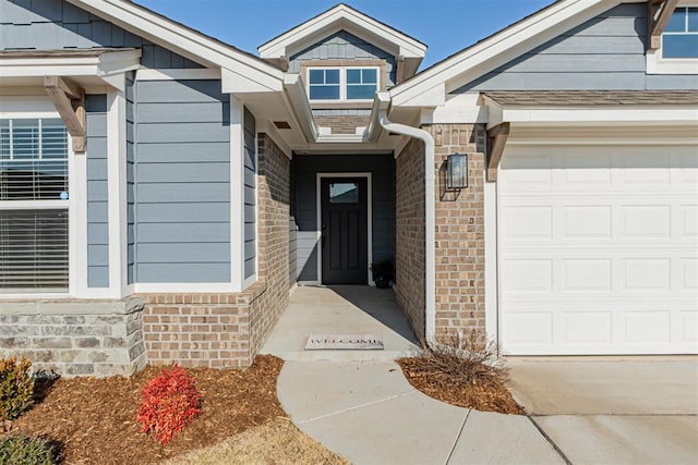 view of exterior entry featuring a garage