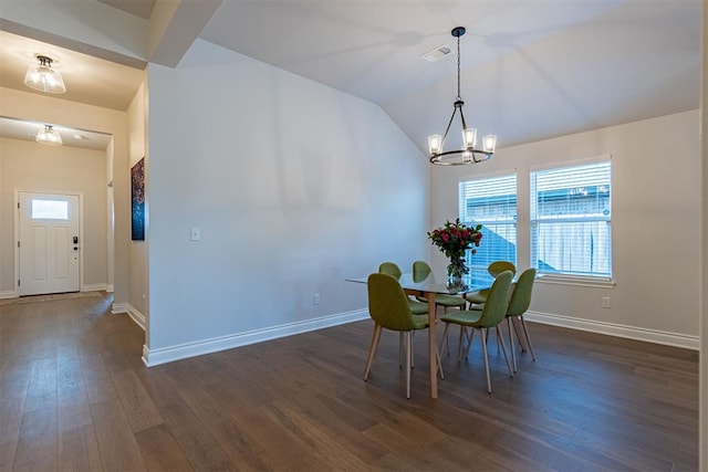 unfurnished dining area with dark hardwood / wood-style floors, an inviting chandelier, and vaulted ceiling