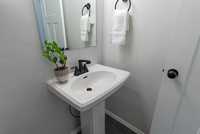 bathroom with tile patterned flooring