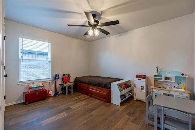 bedroom featuring ceiling fan and dark wood-type flooring