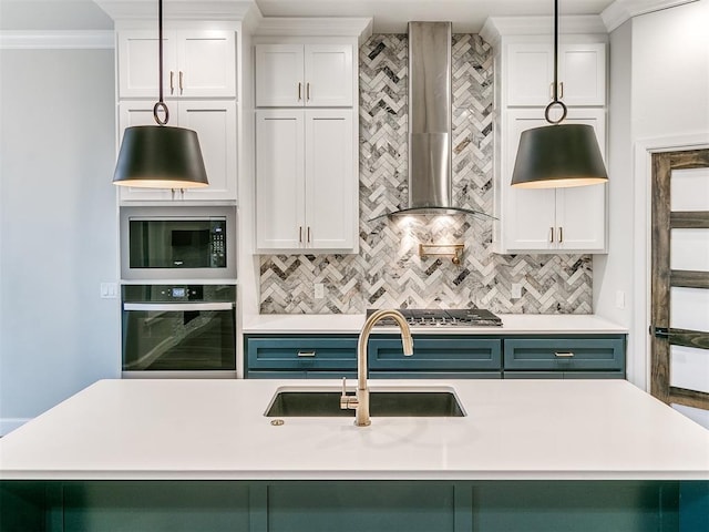 kitchen with wall oven, tasteful backsplash, black microwave, sink, and wall chimney range hood