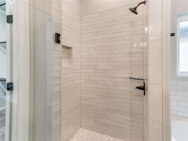 bathroom featuring an enclosed shower