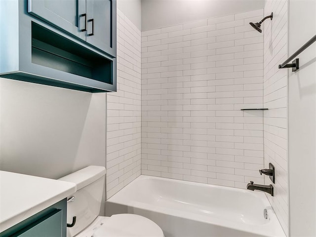 full bathroom with vanity, tiled shower / bath combo, and toilet