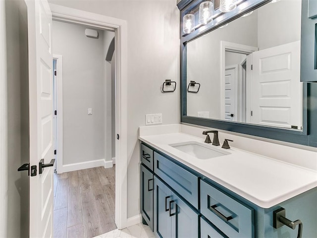 bathroom featuring hardwood / wood-style floors and vanity