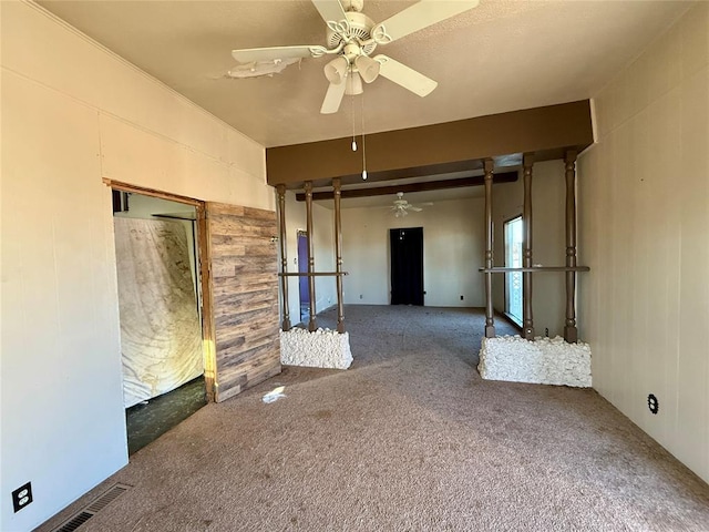 carpeted empty room featuring ceiling fan