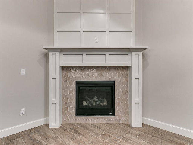 interior details with a tile fireplace