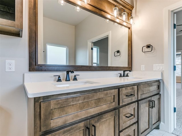 bathroom with vanity, tile patterned floors, and a wealth of natural light