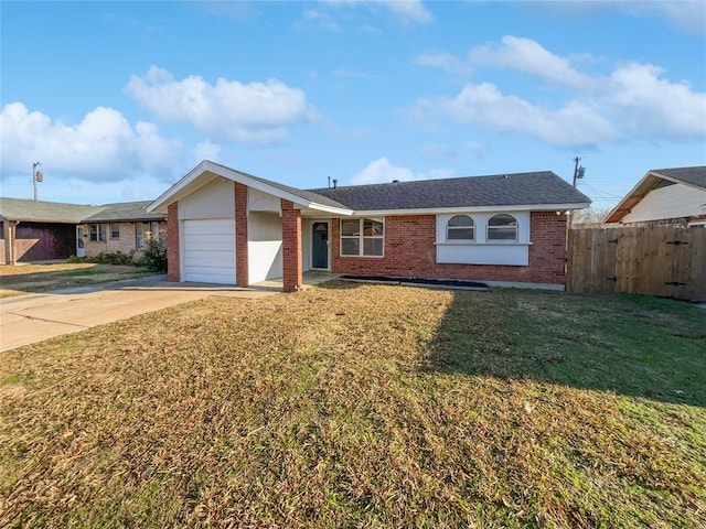 ranch-style home with a front yard and a garage