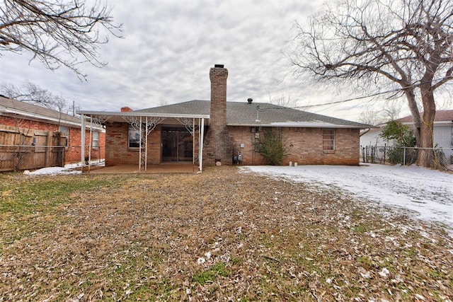 back of house with a patio area, a fenced backyard, and brick siding