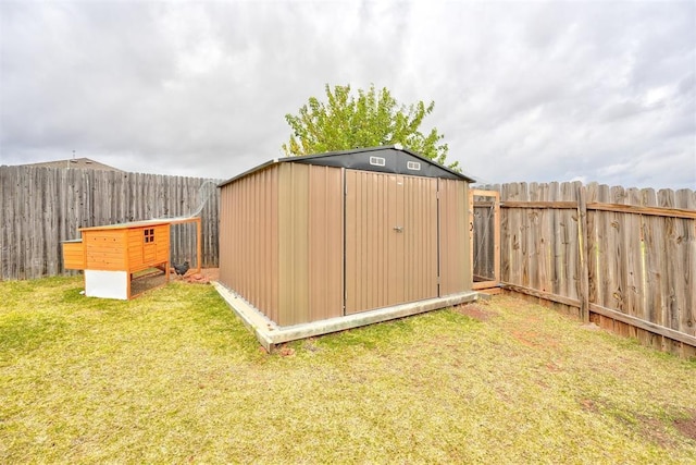 view of outbuilding featuring a yard