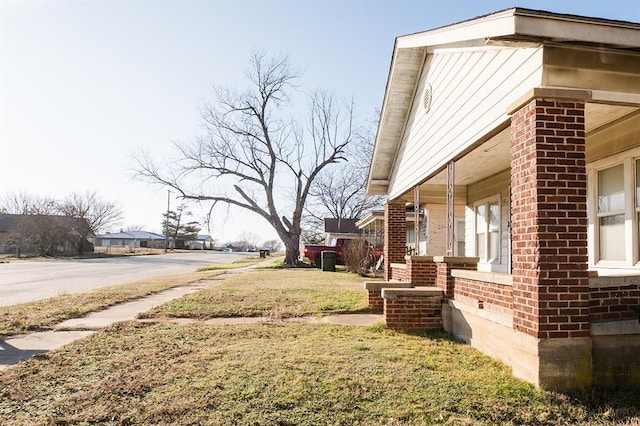 view of yard with covered porch