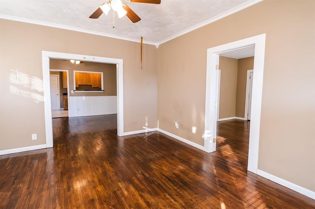 spare room with ceiling fan, dark hardwood / wood-style flooring, and ornamental molding