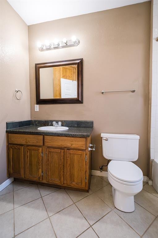 full bathroom featuring tile patterned flooring, bathtub / shower combination, vanity, and toilet