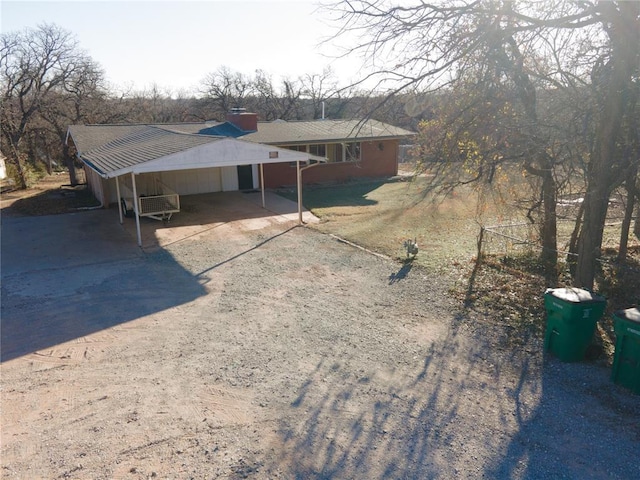 view of front facade with a carport