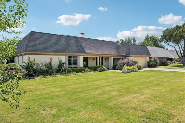 ranch-style home featuring a front yard and a garage