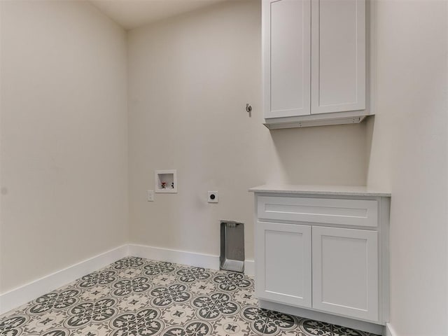 washroom featuring hookup for a washing machine, cabinets, and hookup for an electric dryer