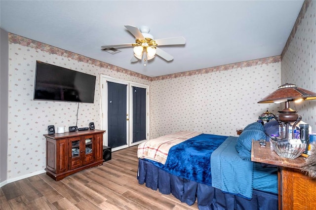 bedroom featuring ceiling fan and wood-type flooring