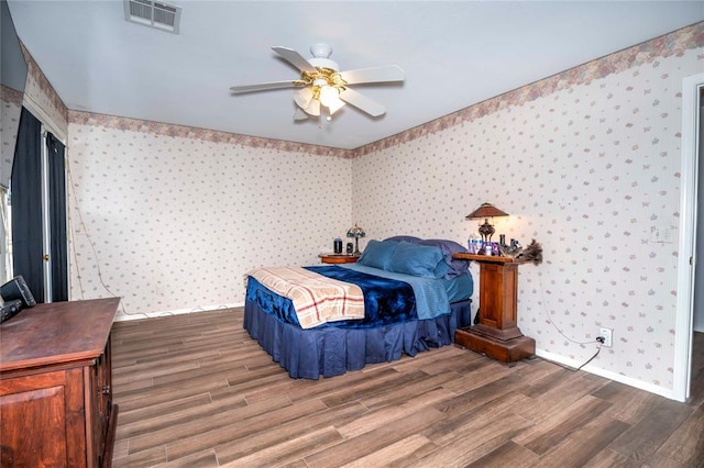 bedroom featuring ceiling fan and hardwood / wood-style floors