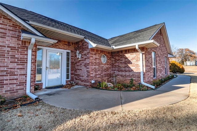 doorway to property with a patio