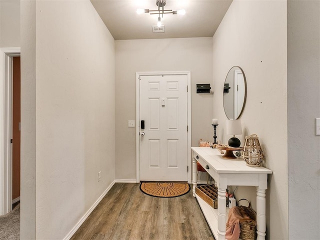 doorway to outside with hardwood / wood-style flooring