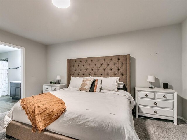 carpeted bedroom with ensuite bathroom