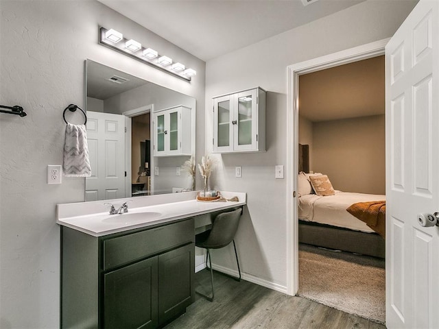 bathroom featuring vanity and wood-type flooring