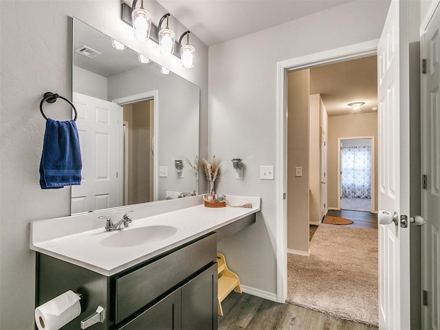 bathroom with wood-type flooring and vanity