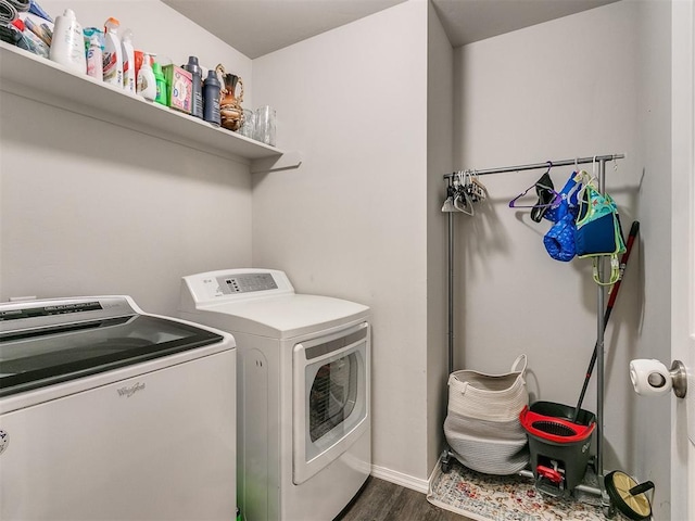 washroom with separate washer and dryer and dark hardwood / wood-style flooring