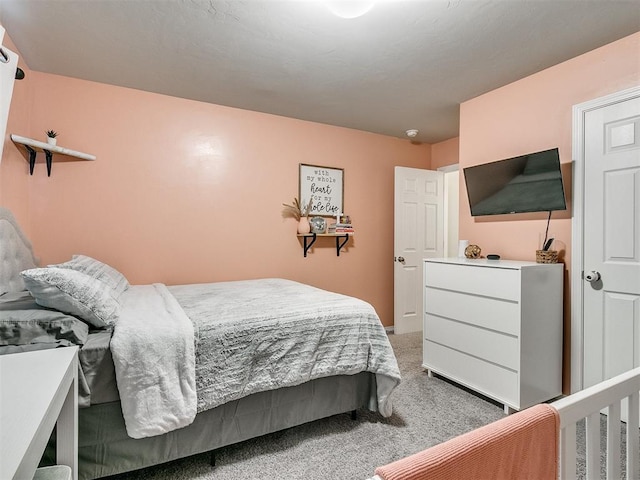 bedroom featuring carpet