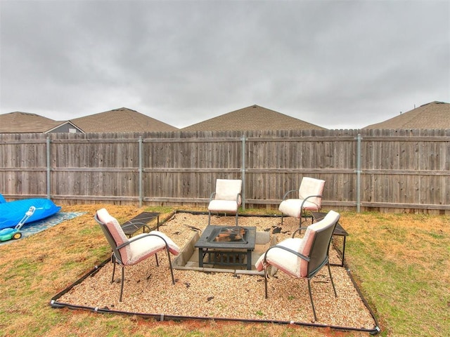 view of yard featuring an outdoor fire pit