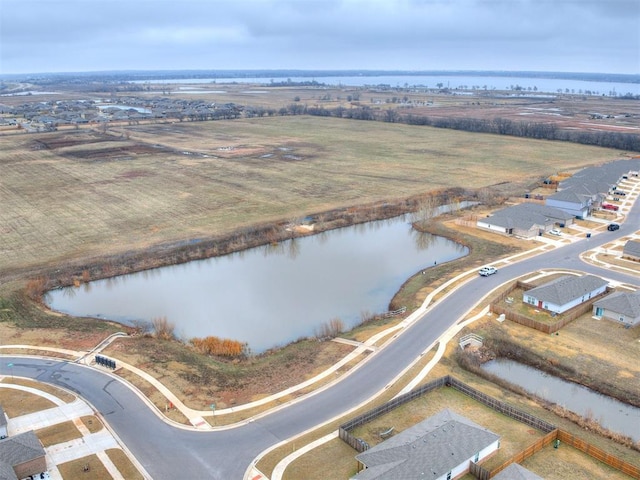 drone / aerial view featuring a rural view and a water view