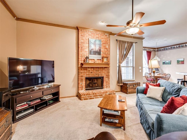 carpeted living room featuring ornamental molding, ceiling fan, and a fireplace