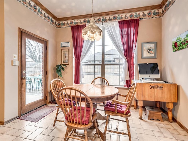 dining space with crown molding and a notable chandelier