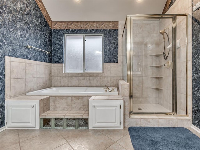 bathroom with independent shower and bath and tile patterned floors